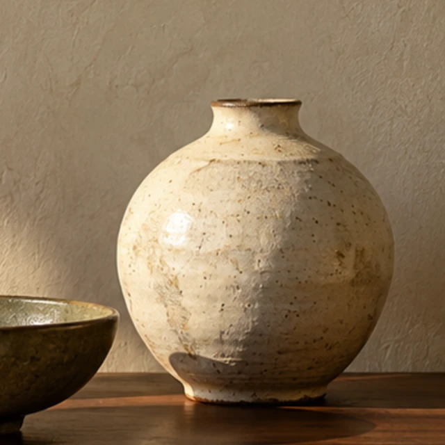 A rounded Cloud Vase in a softly speckled ivory glaze